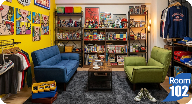 フィギュアや趣味グッズに囲まれた102号室の部屋